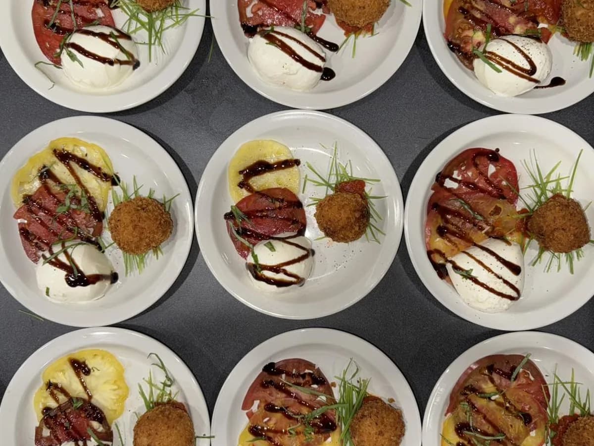 Elegant appetizer plates prepared for polished catered event service.