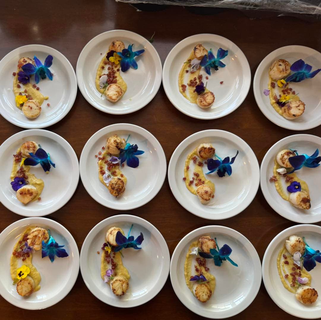 Catered food presentation arranged for guests at an event.