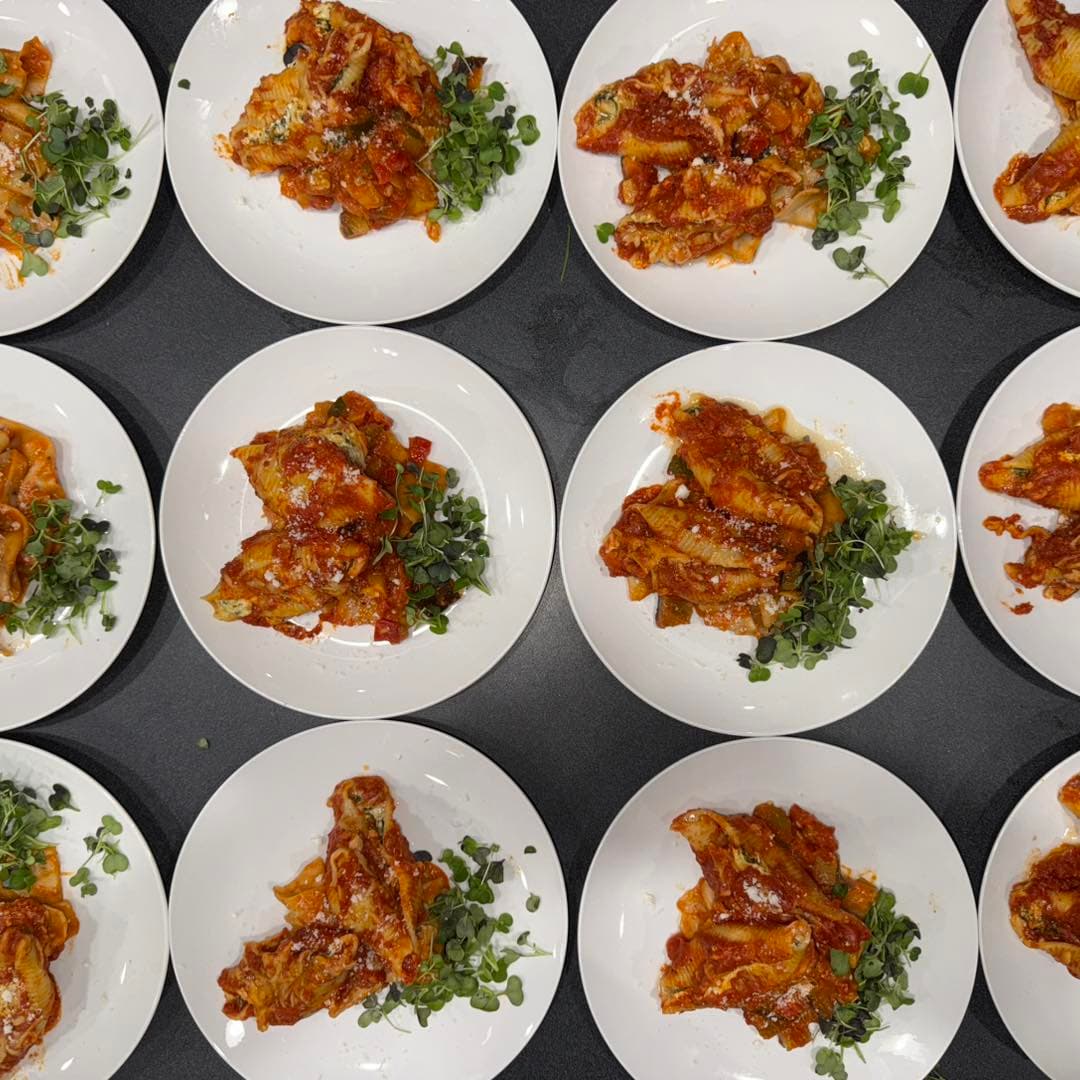 Plated pasta course prepared for a private catered dinner.