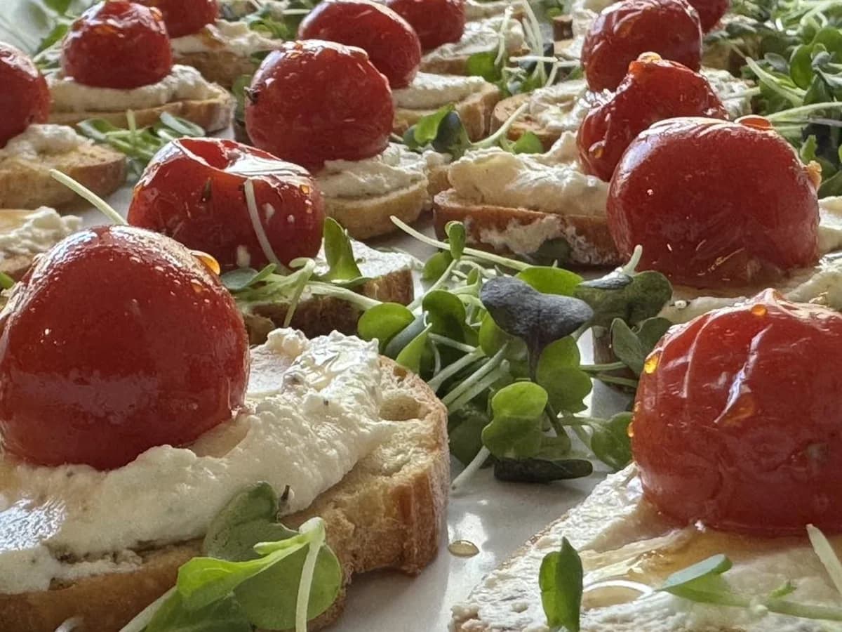 Bruschetta appetizers arranged for cocktail-style catering.