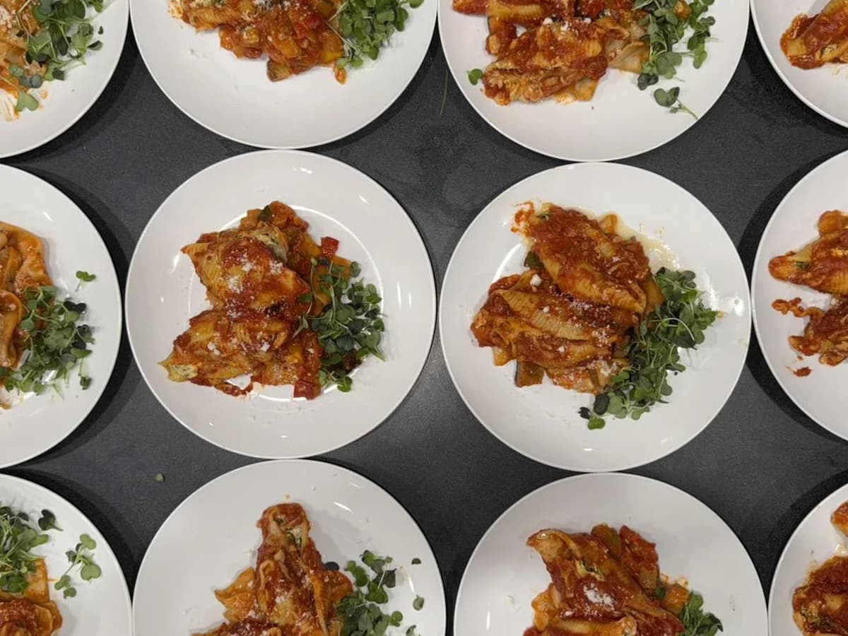 Plated pasta prepared for a private chef dinner.